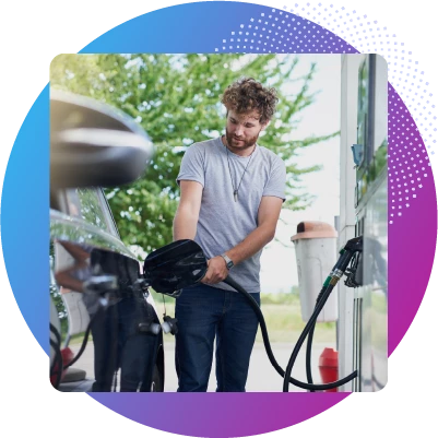 Man filling up his car at a gas station